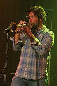 Rob Alley playing the trumpet on stage