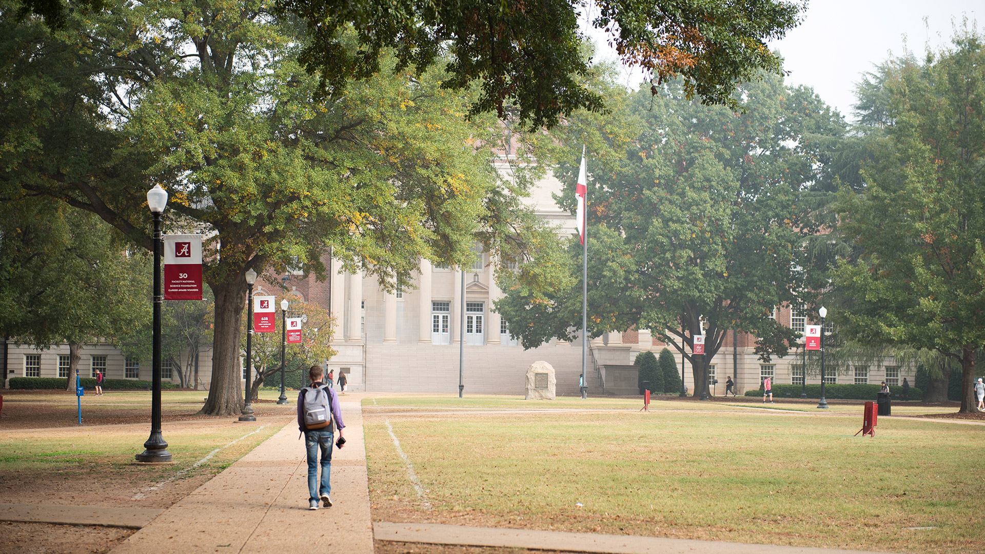 Story Image - Gorgas Library and people walking on the Quad