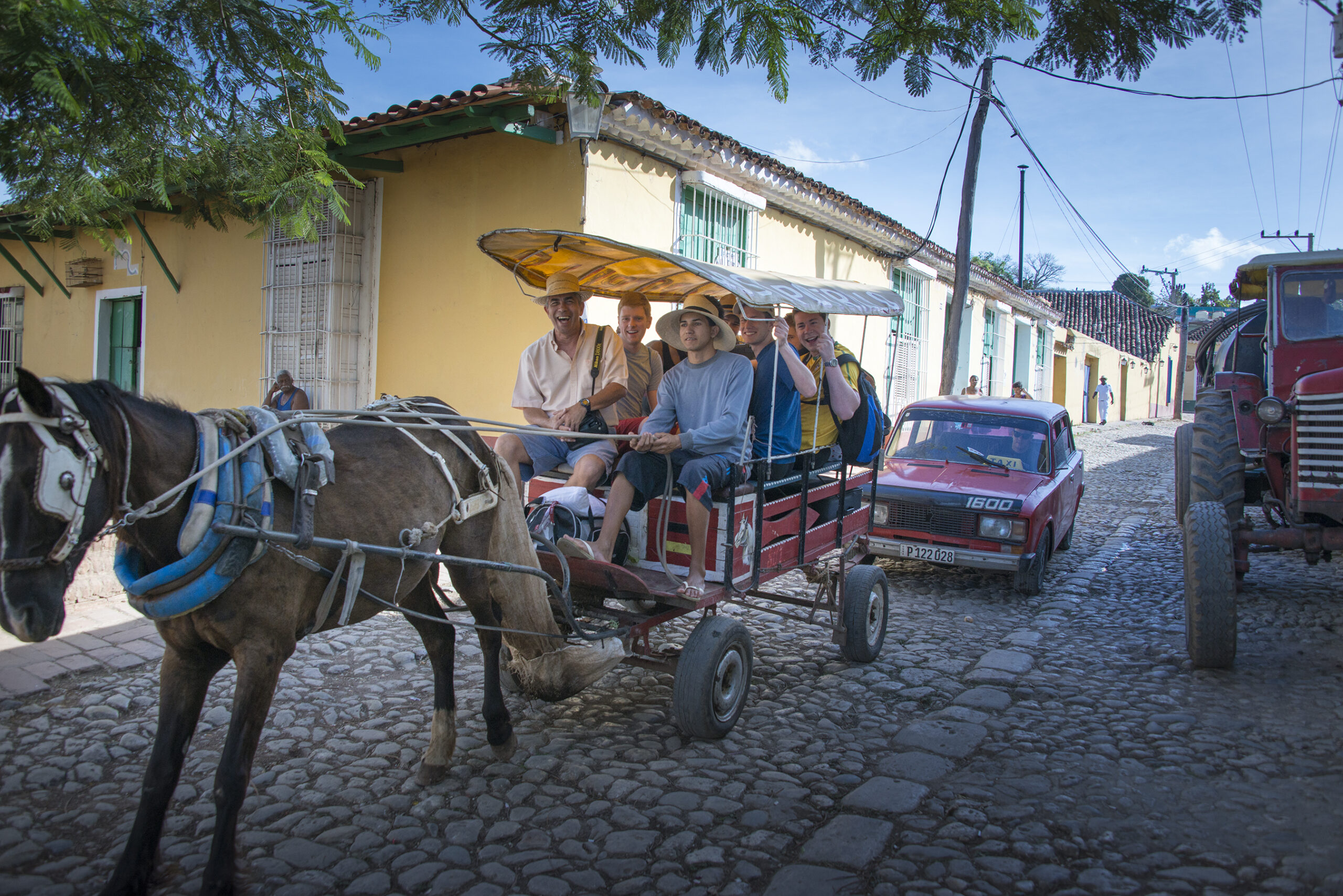 Witt Fellows ride in a horse-drawn cart in Cuba.