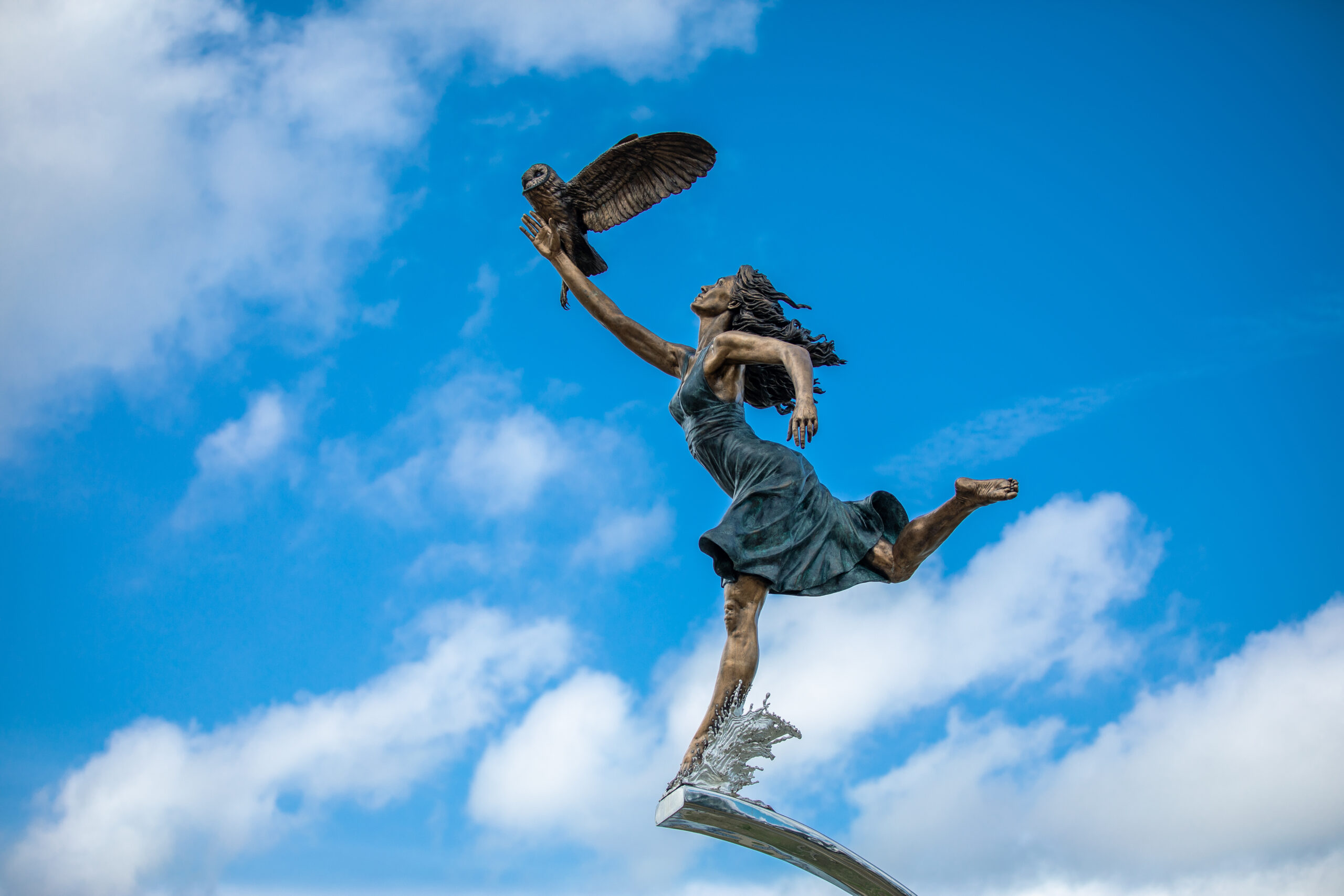 The Minerva Statue at Manderson Landing is a statue of a woman and an owl.