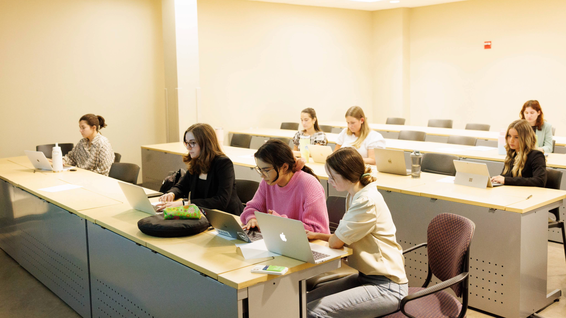 Students sit in a classroom.