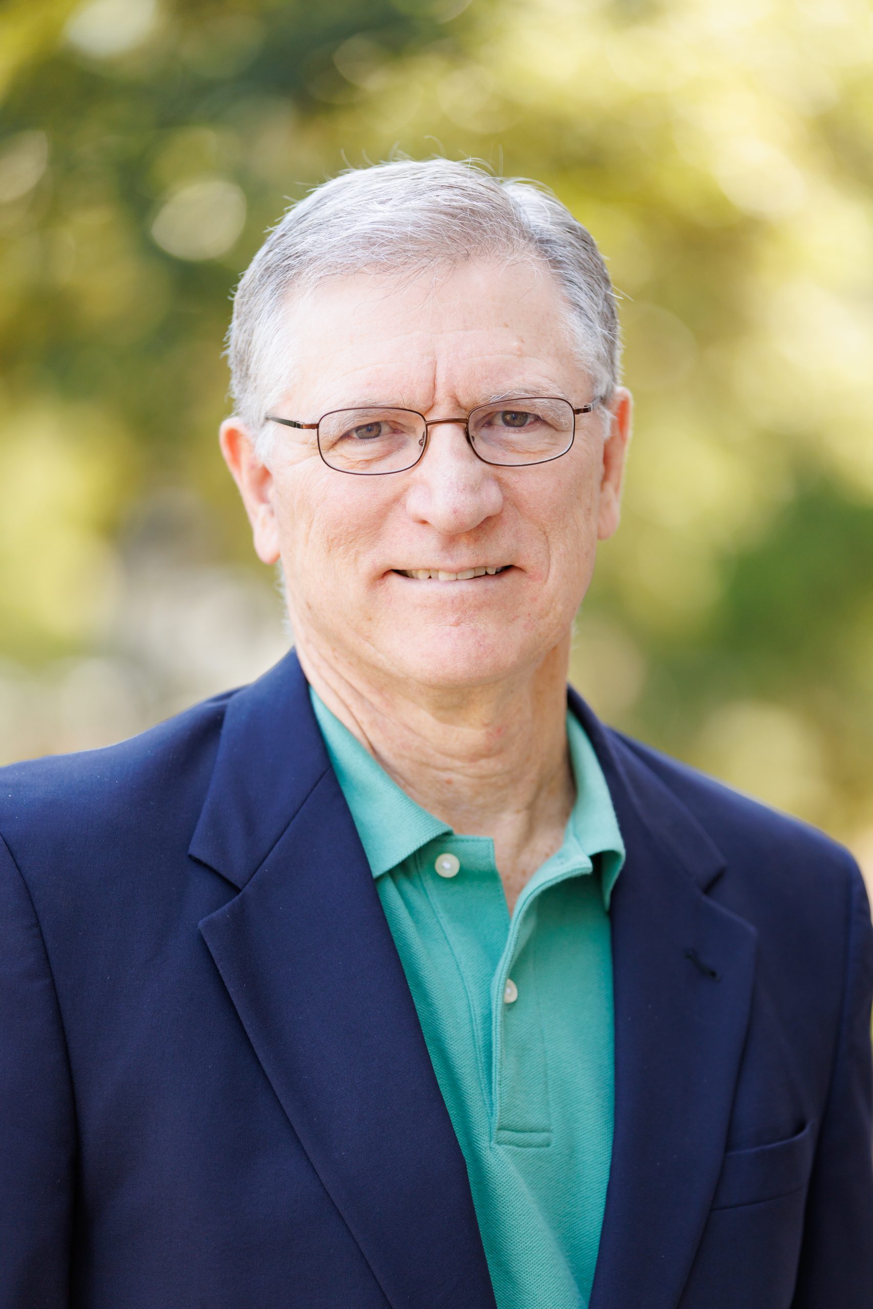 A headshot of John Wheat.