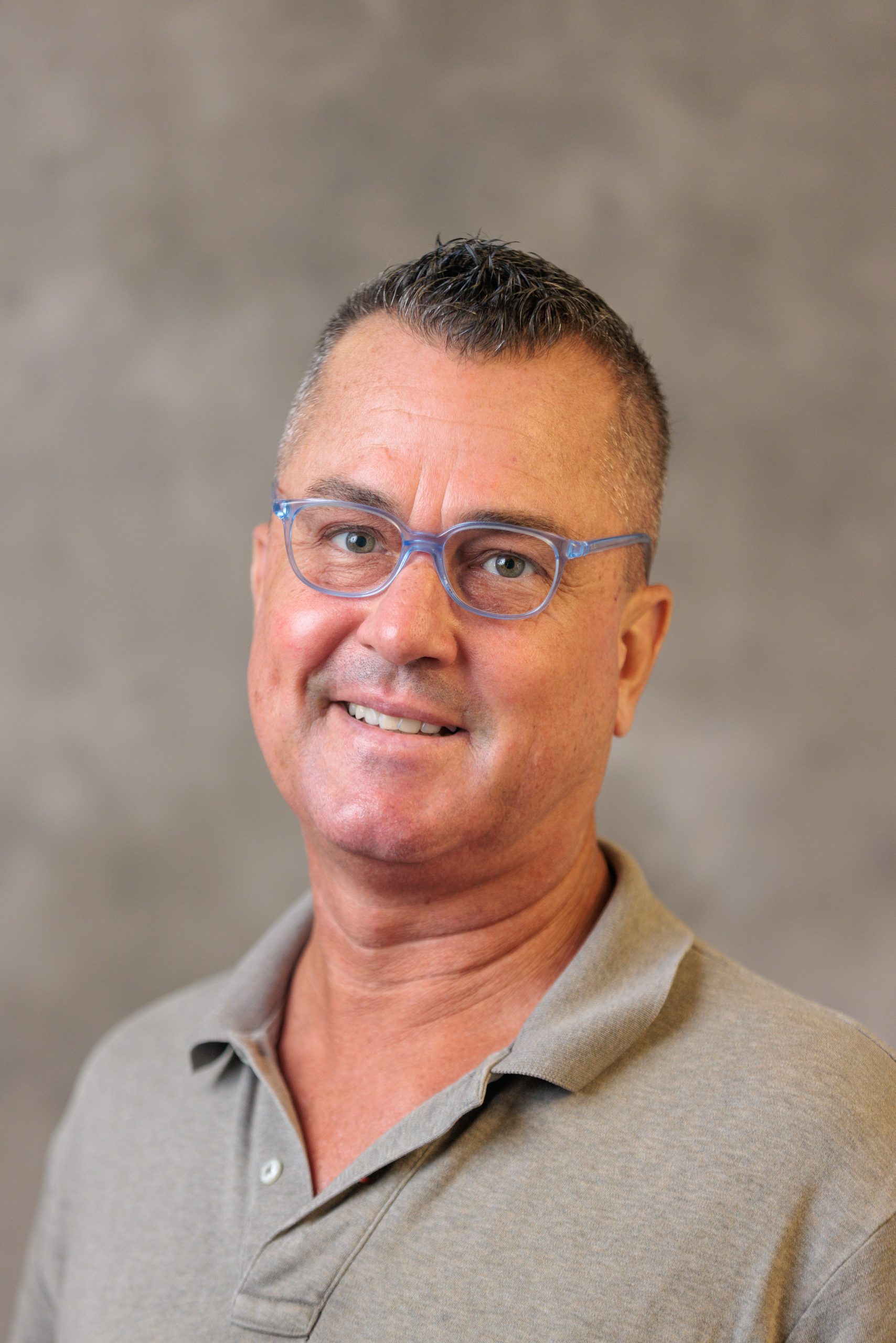 A headshot of Brett Smith.
