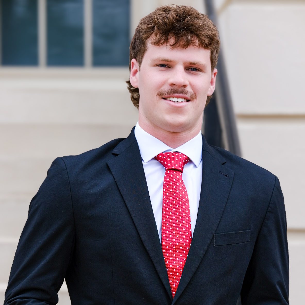 A headshot of Preston Melson.