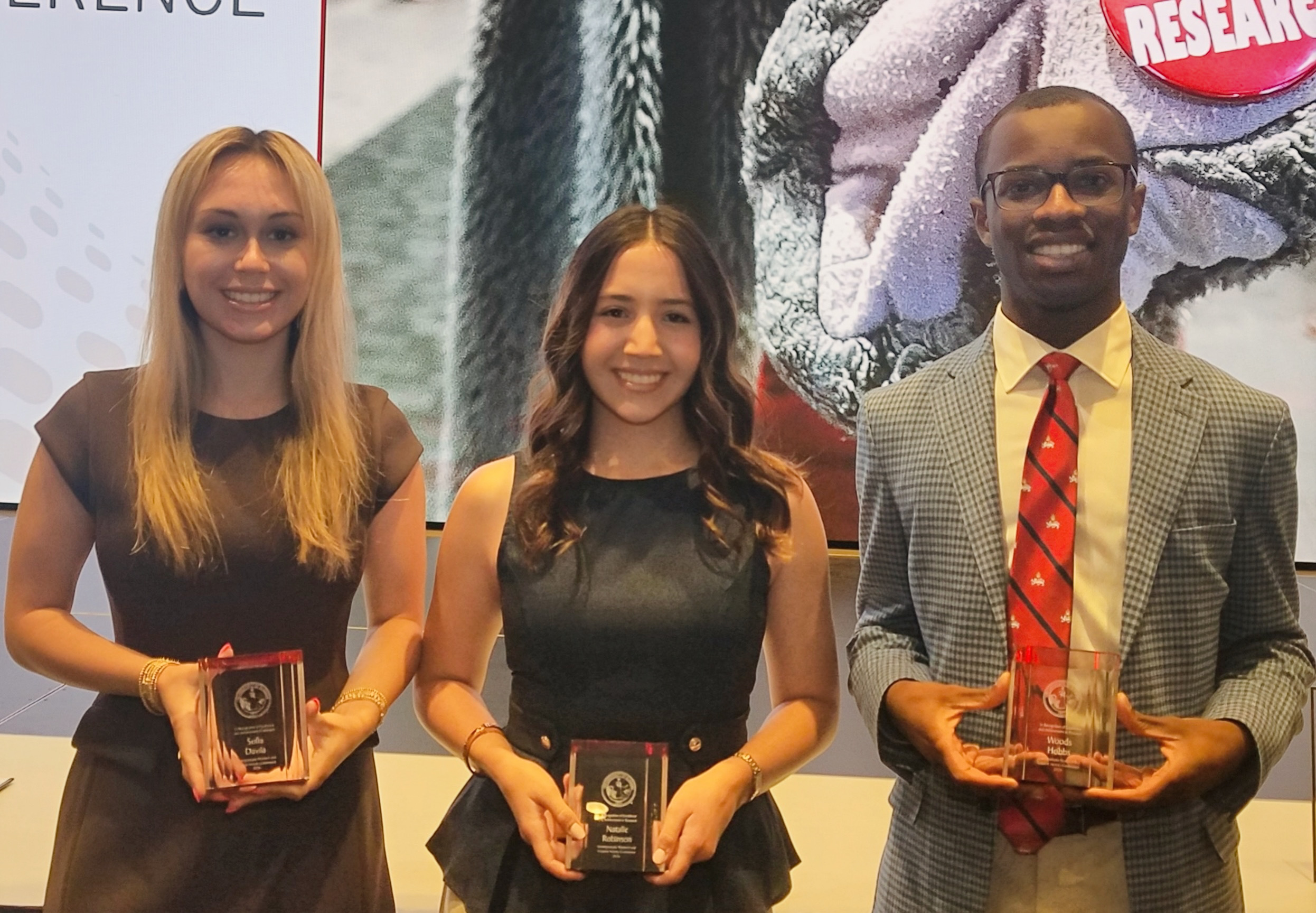 Three award-winning Achieve Scholars at UA's 2026 URCA Awards Ceremony.